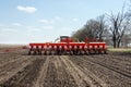 Tractor with trailed planter on the field