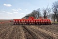 Tractor with trailed planter on the field