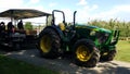 Tractor with a trailer in apple farm Royalty Free Stock Photo