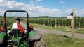 Tractor with a trailer in apple farm Royalty Free Stock Photo