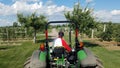 Tractor with a trailer in apple farm Royalty Free Stock Photo