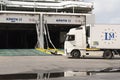 Tractor and trailer rig driving onto an inter island ferry in Heraklion port, Greece.