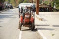 Tractor and trailer stop wait travelers people at Suan Hin Pha Ngam or Thailand`s Kunming