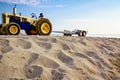 Tractor with trailer for transport boats on the sandy beach Royalty Free Stock Photo