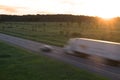 Tractor Trailor in Motion at Sunset Royalty Free Stock Photo