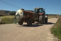 Tractor transporting water tank