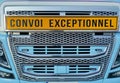 Tractor truck radiator grid showing convoi exceptionnel sign