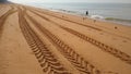 Tractor tyre tracks on the beach, big tyre tracks Royalty Free Stock Photo