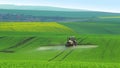 Tractor Watering the Green Field