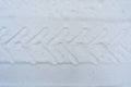 Tractor wheel print on snow Royalty Free Stock Photo