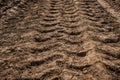 Tractor wheel tracks on the ground