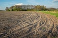 Tractor wheel tracks in a plowed field Royalty Free Stock Photo