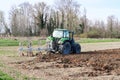 Tractor work agriculture fields field plow plowing land soil tillage Po Valley Italy Italian
