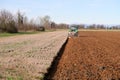 Tractor work agriculture fields field plow plowing land soil tillage Po Valley Italy Italian