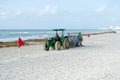 Tractor working at beach to clean sand