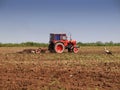 Tractor working farm land Royalty Free Stock Photo