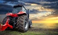 Tractor working on the farm, a modern agricultural transport, a farmer working in the field, tractor at sunset, modern tractor Royalty Free Stock Photo