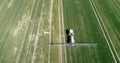 Tractor Working in Field Agriculture. Farmer Sprawying Chemicals GMO on Field. Food Production. Royalty Free Stock Photo