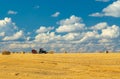 tractor working in field. Baling Equipment for Haystacks and Hay bales work. Attachments to Simplify Hay Farming Royalty Free Stock Photo