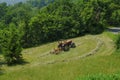 Tractor working in the field. Hay bailing, hay harvesting. Agricultural industry Royalty Free Stock Photo