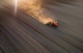 Tractor working in field in spring Royalty Free Stock Photo