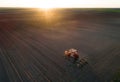 Tractor working in field in spring Royalty Free Stock Photo