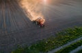 Tractor working in field in spring Royalty Free Stock Photo