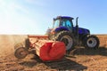 Tractor working in the field. Tractor plow field Agriculture.