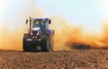 Tractor working in the field. Tractor plow field Agriculture.