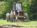 A Tractor Working At Logging Trees