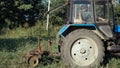 Tractor working on the potato field. Harvesting potatoes with using tractor. Royalty Free Stock Photo