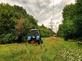 A tractor works in the fields