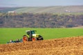 The tractor works the land. Claas Ares 836 RZ Royalty Free Stock Photo