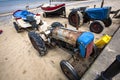 Tractors with boats in the beach at Cromer, North Norfolk, UK