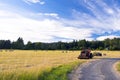 Tractors on the field during the haymaking Royalty Free Stock Photo