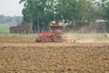 Tractors plow the farm Royalty Free Stock Photo