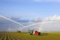 Tractors watering plants Royalty Free Stock Photo