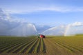 Tractors watering plants Royalty Free Stock Photo