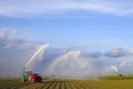 Tractors watering plants Royalty Free Stock Photo