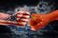 Trade conflict, fists with the flags of USA and China against ea Royalty Free Stock Photo