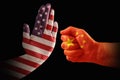 Trade conflict, USA flag on a stop hand and China flag on a fist Royalty Free Stock Photo