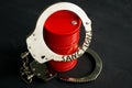 Trade embargo and sanctions. Barrel of oil and handcuffs Royalty Free Stock Photo