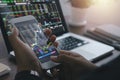 Trade and finance concept.Businessman checking stock market by his smartphone and laptop.trading graph, financial investment Royalty Free Stock Photo