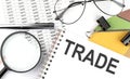 TRADE - the inscription of text on the Notepad, and chart. Business concept Royalty Free Stock Photo