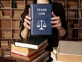TRADE LAW book in the hands of a attorney. The rise in prominence of trade law following the creation of the World Trade Royalty Free Stock Photo