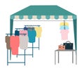 Trade tent with clothes flat vector illustration. Street market, fair awning. Outdoor local clothing store, shop cartoon concept Royalty Free Stock Photo