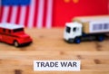 Trade War shipping concept with trucks and USA and China flag in background Royalty Free Stock Photo