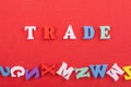 TRADE word on red background composed from colorful abc alphabet block wooden letters, copy space for ad text. Learning english Royalty Free Stock Photo