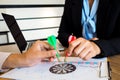 Trader team holding a darts aiming at the target center of dart board, Setting challenging trading goals And ready to achieve