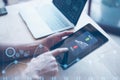 Trader using smartphone and computer laptop to trade carbon credit on application. Net zero emission